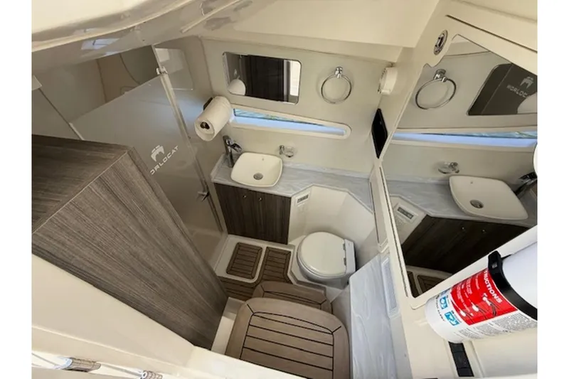 Slide: The Image of Luxurious 2021 World Cat 400 DC-X boat bathroom with modern amenities and sleek design. - 11