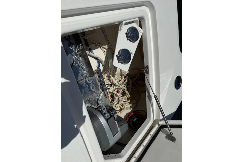 Slide: The Image of Storage compartment of 2021 World Cat 400 DC-X boat with ropes and equipment. - 15