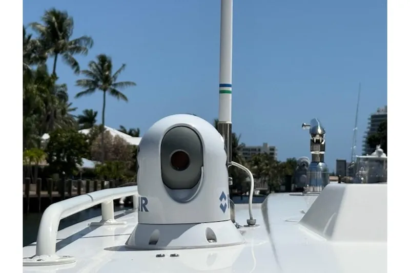 Slide: The Image of 2021 World Cat 400 DC-X boat with radar equipment, docked near palm trees. - 18