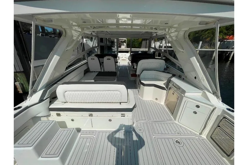 Slide: The Image of Interior view of 2021 World Cat 400 DC-X boat, featuring spacious seating and modern amenities. - 21
