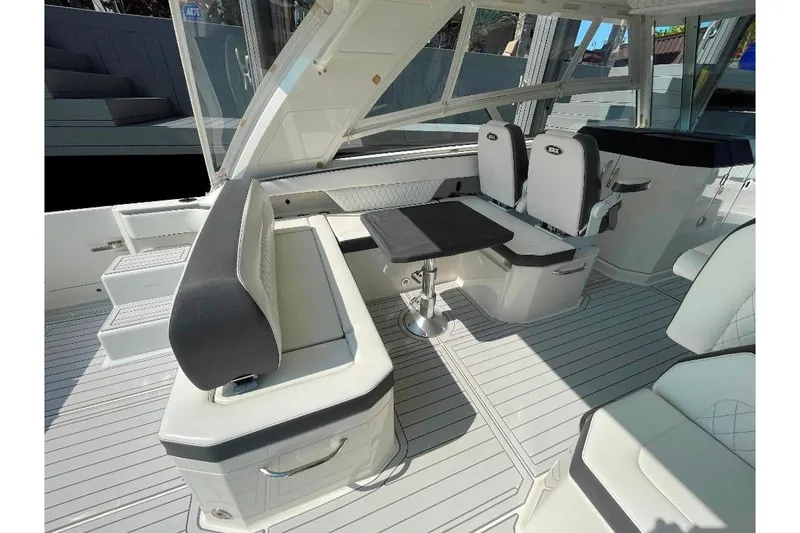 Slide: The Image of Luxurious interior of 2021 World Cat 400 DC-X boat with seating and table. - 23