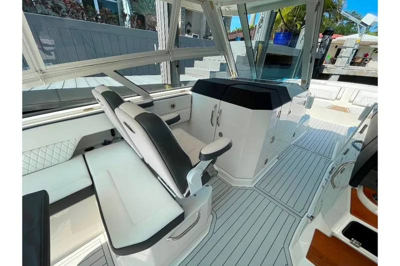 Slide: The Image of Interior of 2021 World Cat 400 DC-X boat with sleek seating and modern design. - 25