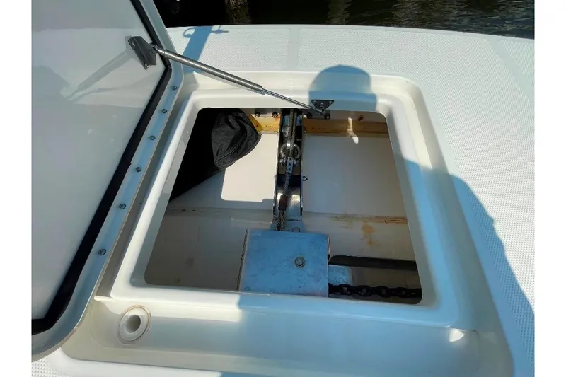 Slide: The Image of Open anchor locker on 2021 World Cat 400 DC-X boat, showing chain and mechanism. - 30