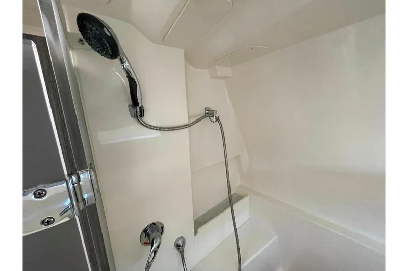 Slide: The Image of Shower area in 2021 World Cat 400 DC-X boat, featuring modern fixtures and sleek design. - 37