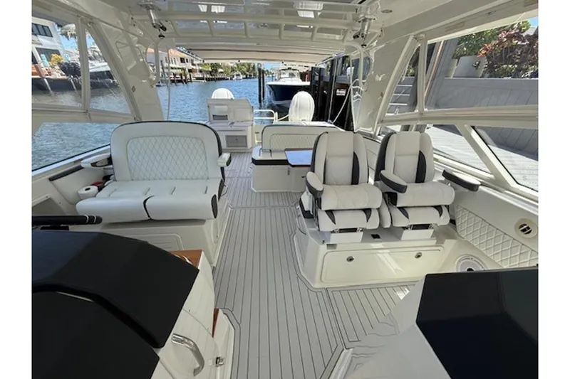 Slide: The Image of Luxurious interior of 2021 World Cat 400 DC-X boat with plush seating and modern design. - 4
