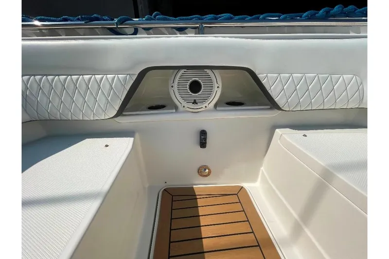Slide: The Image of Interior of 2021 World Cat 400 DC-X boat with cushioned seating and speaker. - 40