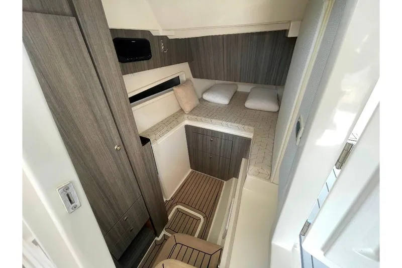 Slide: The Image of Interior cabin of 2021 World Cat 400 DC-X, featuring modern design and cozy sleeping area. - 42
