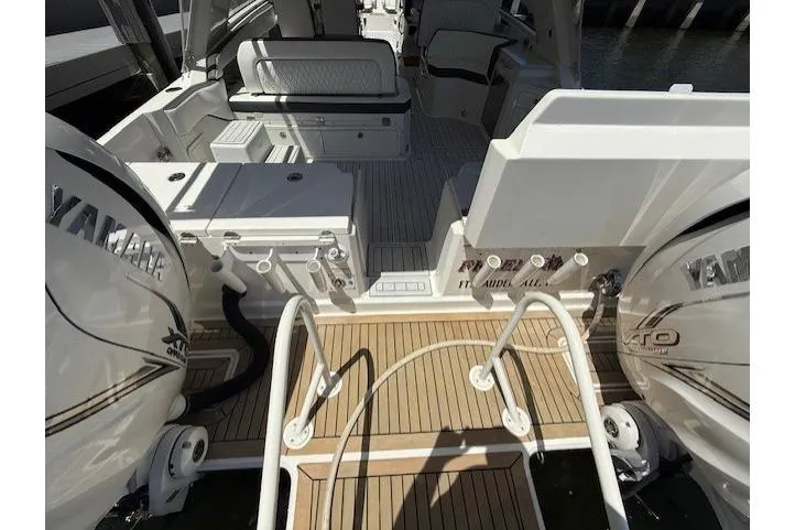 Slide: The Image of 2021 World Cat 400 DC-X boat deck with Yamaha engines, featuring spacious seating and modern amenities. - 52