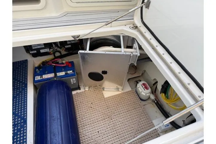 Slide: The Image of 2021 World Cat 400 DC-X boat storage compartment with battery and equipment. - 58