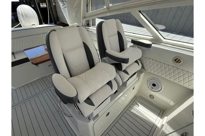 Slide: The Image of Luxurious seating in 2021 World Cat 400 DC-X boat interior, featuring elegant design and comfort. - 6