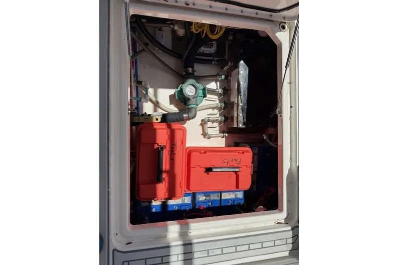 Slide: The Image of Engine compartment of 2021 World Cat 400 DC-X with visible components and storage. - 60