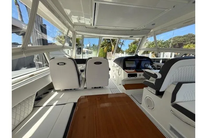 Slide: The Image of Luxurious interior of 2021 World Cat 400 DC-X boat with modern seating and helm. - 66
