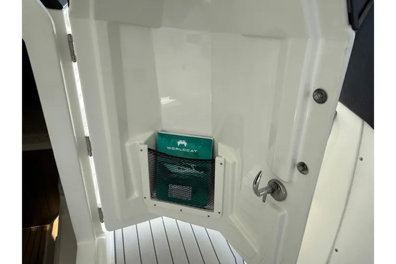 Slide: The Image of Interior view of 2021 World Cat 400 DC-X boat with storage compartment. - 7