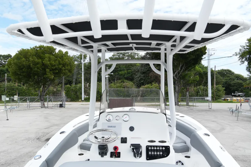 Slide: The Image of 2025 NauticStar 222 Offshore boat cockpit with steering wheel and controls. - 4