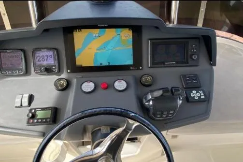 Slide: The Image of 2014 Aquila 48 PC yacht dashboard with navigation and control instruments. - 17