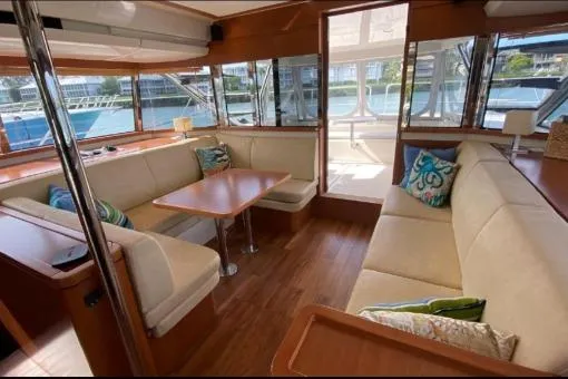 Slide: The Image of Luxurious interior of 2014 Aquila 48 PC yacht with elegant seating and wooden finishes. - 6