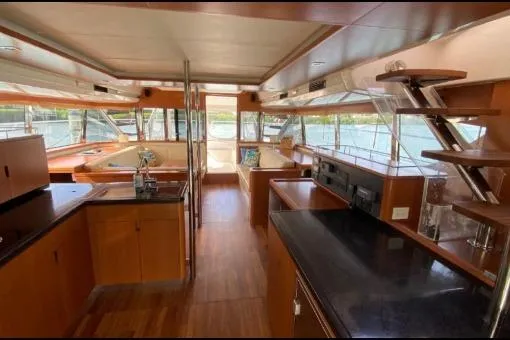 Slide: The Image of Interior of 2014 Aquila 48 PC yacht with modern kitchen and panoramic windows. - 8
