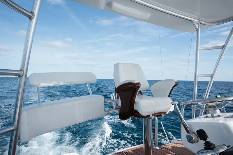 Slide: The Image of 2018 Viking 37 Billfish yacht helm with ocean view and white seating. - 10