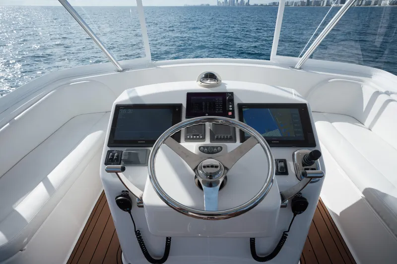 Slide: The Image of Cockpit of 2018 Viking 37 Billfish yacht with navigation screens and steering wheel. - 13