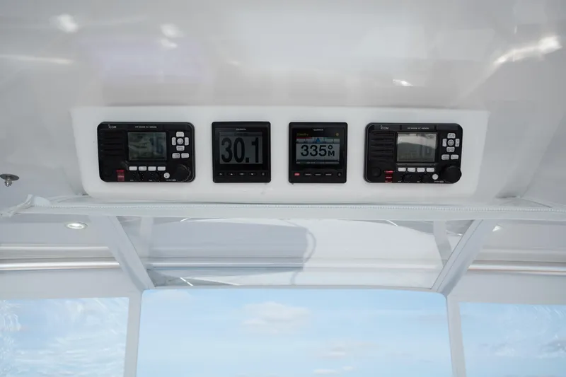 Slide: The Image of 2018 Viking 37 Billfish dashboard with navigation and communication instruments. - 14