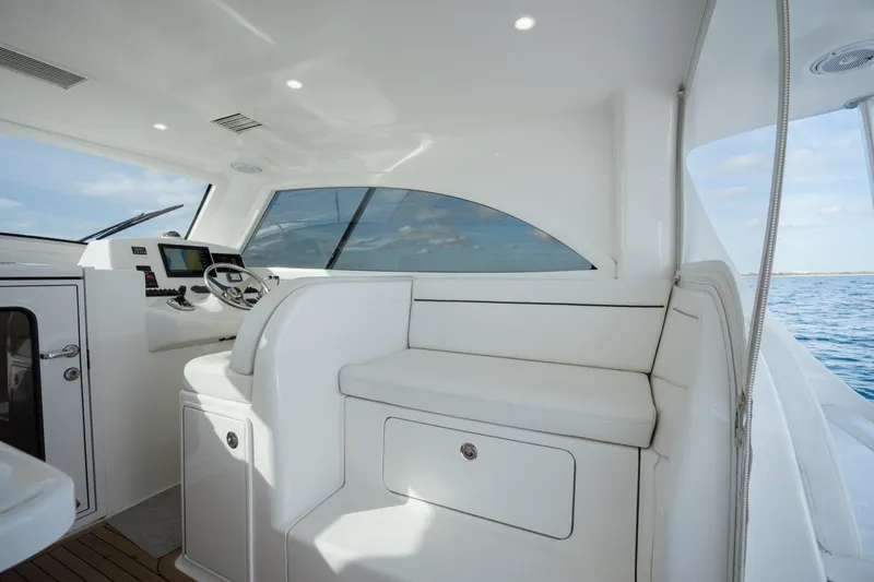 Slide: The Image of Interior of 2018 Viking 37 Billfish yacht with modern helm and seating. - 17