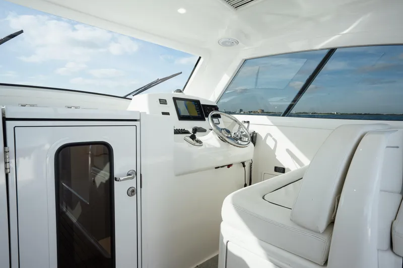 Slide: The Image of 2018 Viking 37 Billfish helm with modern controls and panoramic windows. - 21