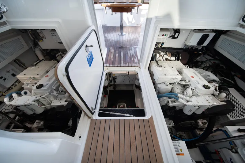 Slide: The Image of Engine room of 2018 Viking 37 Billfish yacht, showcasing dual engines and mechanical systems. - 22