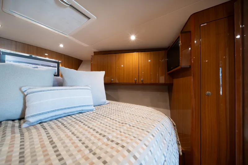 Slide: The Image of Luxurious cabin interior of 2018 Viking 37 Billfish yacht with elegant wood finish. - 25