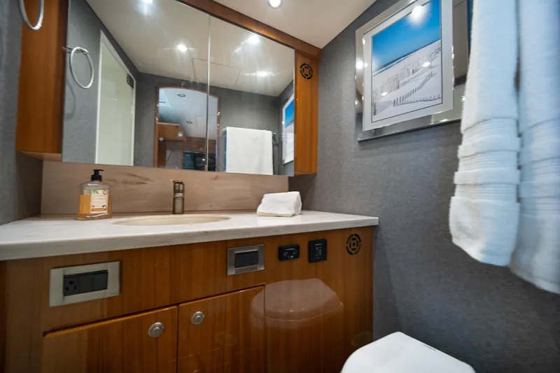Slide: The Image of Luxurious bathroom in 2018 Viking 37 Billfish yacht with modern fixtures and elegant decor. - 26