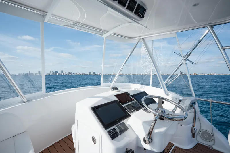 Slide: The Image of 2018 Viking 37 Billfish helm with ocean view and city skyline in the background. - 3