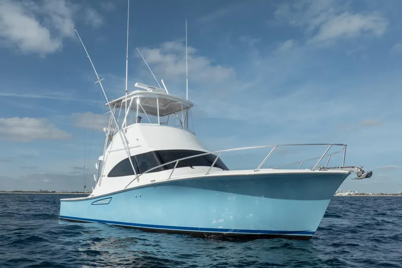 Slide: The Image of 2018 Viking 37 Billfish yacht on open water under clear blue sky. - 31