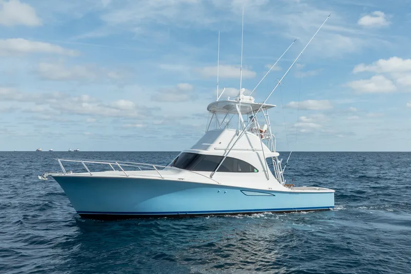 Slide: The Image of 2018 Viking 37 Billfish yacht cruising on open ocean under blue sky. - 34
