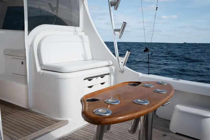 Slide: The Image of 2018 Viking 37 Billfish yacht interior with fishing rod holders and ocean view. - 6