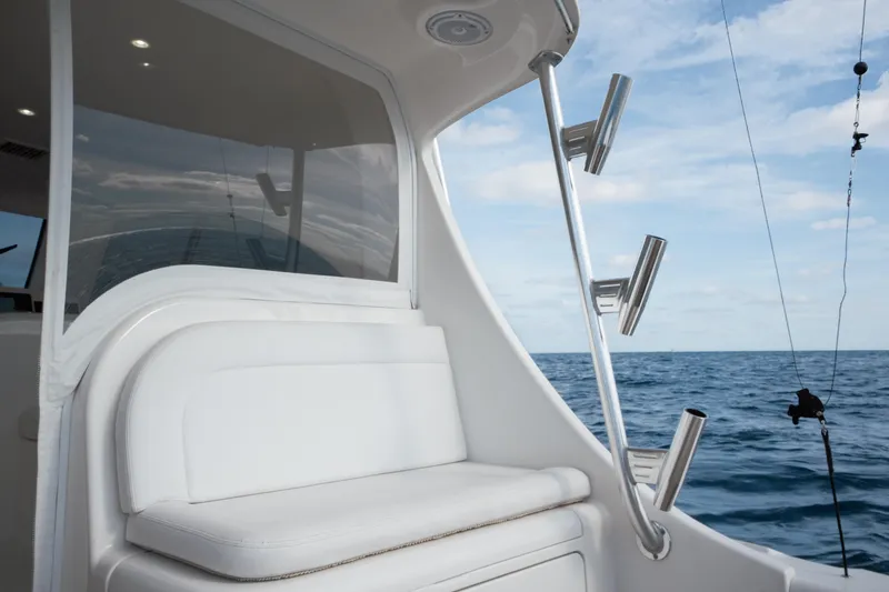 Slide: The Image of 2018 Viking 37 Billfish boat interior with ocean view and fishing rod holders. - 9