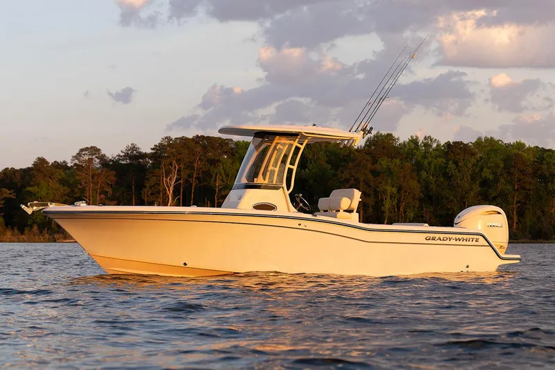 Slide: The Image of 2026 Grady-White Fisherman 236 boat on trailer, sunny day. - 2