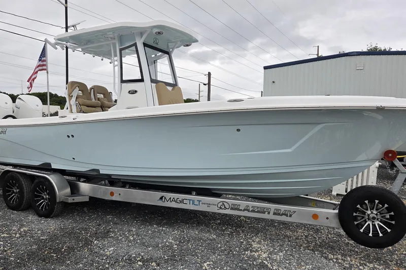 The Image of 2026 Blazer Bay Makaira 2800 boat on trailer, displayed outdoors. - 0