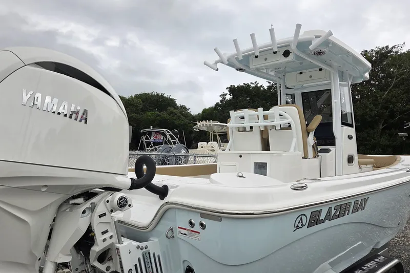 Slide: The Image of 2026 Blazer Bay Makaira 2800 boat dashboard with steering wheel and controls. - 11