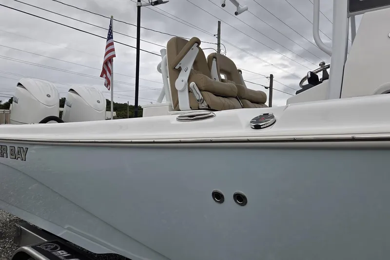 Slide: The Image of 2026 Blazer Bay Makaira 2800 boat with Yamaha engine, showcased outdoors. - 12