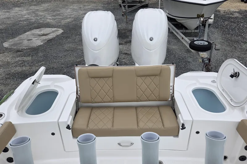 Slide: The Image of 2026 Blazer Bay Makaira 2800 boat interior with storage compartments and seating. - 4