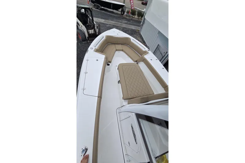 Slide: The Image of 2026 Blazer Bay Makaira 2800 boat interior with rod holders and storage compartments. - 6