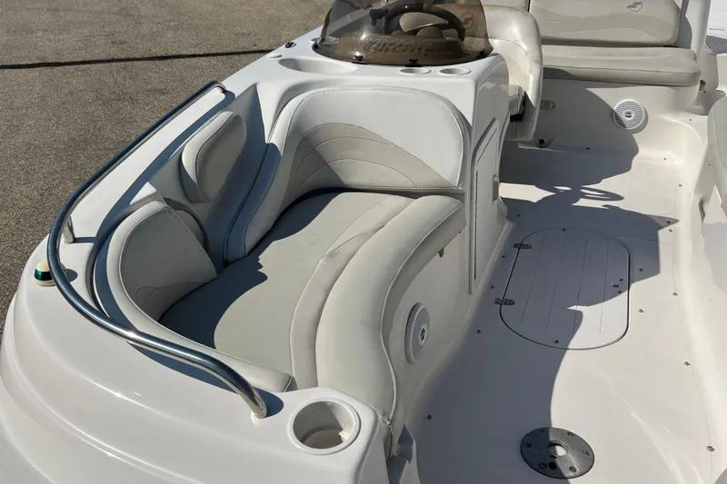 Slide: The Image of 2004 Starcraft Aurora 2000 I/O boat interior with white seating and steering console. - 13