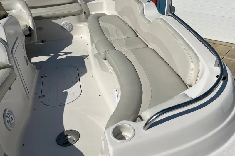 Slide: The Image of 2004 Starcraft Aurora 2000 I/O boat interior with white seating and storage compartments. - 14