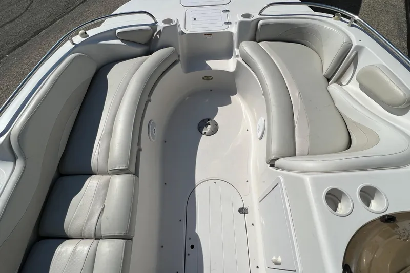 Slide: The Image of 2004 Starcraft Aurora 2000 I/O boat interior with white cushioned seating. - 3