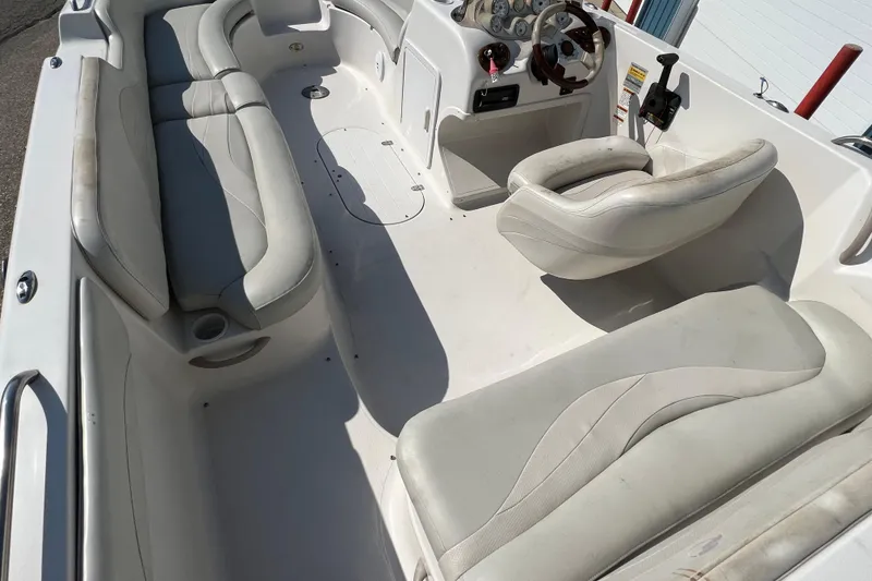 Slide: The Image of 2004 Starcraft Aurora 2000 I/O boat interior with white seating and steering console. - 5