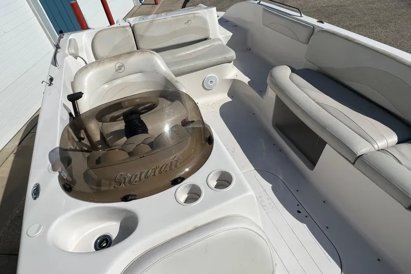 Slide: The Image of 2004 Starcraft Aurora 2000 I/O boat interior with seating and steering console. - 6