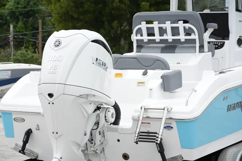 Slide: The Image of 2025 NauticStar 242 Offshore boat with Yamaha 300 V6 engine, rear view. - 5