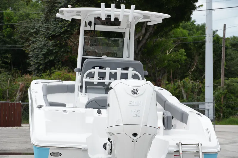 Slide: The Image of 2025 NauticStar 242 Offshore boat with Yamaha 300 V6 engine, rear view. - 6