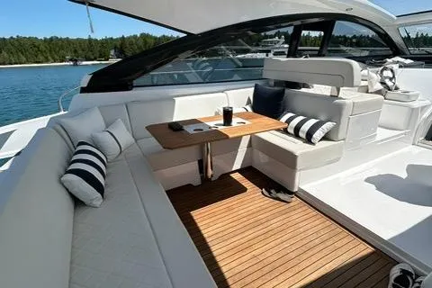 Slide: The Image of Luxurious 2020 Fairline 45/43 Targa yacht interior with elegant seating and wooden deck. - 2