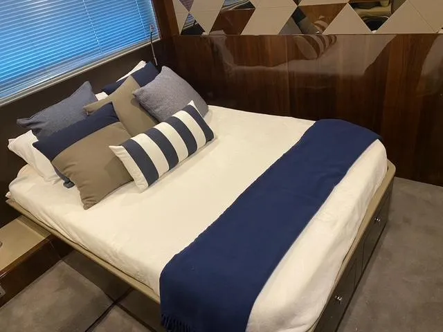 Slide: The Image of Luxurious bedroom interior of 2020 Fairline 45/43 Targa yacht with elegant bedding. - 5