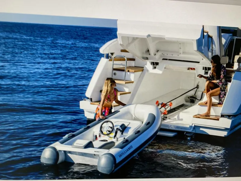 Slide: The Image of Fairline 45/43 Targa 2020 yacht with tender boat on open sea. - 18